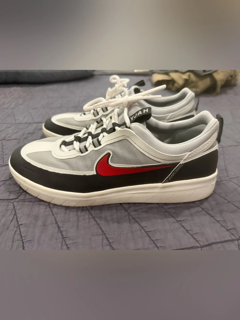 Nike White and Black Low-Top Sneakers with Red Swoosh